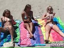 Sexy ladies in bikiniz oil each other and relax under hot sun shine. - Playful Milfs Have Fun On The Beach 2